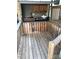 Covered outdoor kitchen area with wooden deck at 111 Hollywood Trl, Mount Gilead, NC 27306