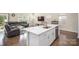 Open kitchen features a large island with white cabinets and stainless steel appliances at 168 Ravensara Ave, Fort Mill, SC 29715