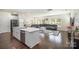Open concept kitchen with white cabinets, island, and stainless steel appliances at 168 Ravensara Ave, Fort Mill, SC 29715