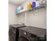 Laundry room with washer, dryer, and shelving for storage at 168 Ravensara Ave, Fort Mill, SC 29715