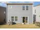 Gray house exterior with small backyard and sliding glass door at 168 Ravensara Ave, Fort Mill, SC 29715