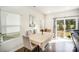 Bright dining area with table and chairs, adjacent to sliding glass doors leading to backyard at 168 Ravensara Ave, Fort Mill, SC 29715