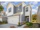 Two-story home with gray siding, white accents, and a two-car garage at 168 Ravensara Ave, Fort Mill, SC 29715