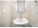 Small bathroom with pedestal sink and oval mirror at 168 Ravensara Ave, Fort Mill, SC 29715