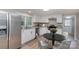 Modern kitchen with white cabinets, granite counters, and stainless steel appliances at 7714 Old Waxhaw Monroe Rd, Waxhaw, NC 28173