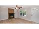 Living room featuring a brick fireplace and hardwood floors at 7714 Old Waxhaw Monroe Rd, Waxhaw, NC 28173