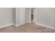 Small bedroom with closet and access to kitchen at 7714 Old Waxhaw Monroe Rd, Waxhaw, NC 28173