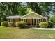 Brick ranch home with covered porch and manicured lawn at 7714 Old Waxhaw Monroe Rd, Waxhaw, NC 28173