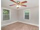Bright bedroom with neutral walls and carpet flooring at 7714 Old Waxhaw Monroe Rd, Waxhaw, NC 28173