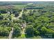 Aerial view of home on wooded lot near a road at 7714 Old Waxhaw Monroe Rd, Waxhaw, NC 28173