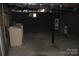Unfinished basement with laundry hookups and storage space at 203 West Dr, Albemarle, NC 28001