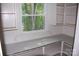 Walk-in pantry with ample shelving and a window at 203 West Dr, Albemarle, NC 28001