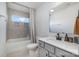 Clean bathroom with single vanity, bathtub, and window at 29060 Low Country Ln, Lancaster, SC 29720