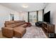 Relaxing living room featuring a sectional sofa and plenty of natural light at 29060 Low Country Ln, Lancaster, SC 29720