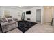 Bright living area with sectional sofa, large TV, and ample natural light at 29060 Low Country Ln, Lancaster, SC 29720