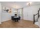 Dining room features hardwood floors, round table with black chairs, and entryway at 29060 Low Country Ln, Lancaster, SC 29720