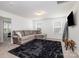 Spacious living room featuring a comfortable sectional sofa and plush rug at 29060 Low Country Ln, Lancaster, SC 29720