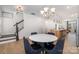 Dining area with hardwood floors, chandelier, and view of kitchen at 29060 Low Country Ln, Lancaster, SC 29720