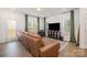 Spacious living room with a large sectional sofa and flat-screen TV at 29060 Low Country Ln, Lancaster, SC 29720