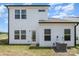 Rear view of house showcasing clean siding and landscaping at 29060 Low Country Ln, Lancaster, SC 29720