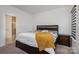 Bright bedroom with ensuite bathroom access and dark wood furniture at 29060 Low Country Ln, Lancaster, SC 29720