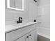 Modern bathroom with white vanity and bathtub at 115 E Georgia Ave, Bessemer City, NC 28016