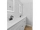 Modern bathroom with white cabinets and black matte fixtures at 115 E Georgia Ave, Bessemer City, NC 28016
