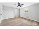 Spacious bedroom with bathroom access and ceiling fan at 115 E Georgia Ave, Bessemer City, NC 28016