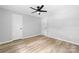 Simple bedroom with light gray walls and wood-look flooring at 115 E Georgia Ave, Bessemer City, NC 28016