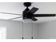 Black ceiling fan with five blades and a light kit at 115 E Georgia Ave, Bessemer City, NC 28016