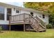 Wooden deck and stairs leading to backyard at 115 E Georgia Ave, Bessemer City, NC 28016