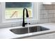 Sleek kitchen sink and black gooseneck faucet at 115 E Georgia Ave, Bessemer City, NC 28016