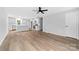 Spacious living room with light gray walls and wood-look flooring at 115 E Georgia Ave, Bessemer City, NC 28016