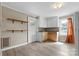 Small kitchen with white cabinets, wood countertops, and vinyl flooring at 323 20Th St, Kannapolis, NC 28083