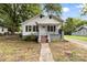White bungalow with a front porch at 323 20Th St, Kannapolis, NC 28083