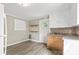 Small kitchen with white cabinets, wood countertops, and vinyl flooring at 323 20Th St, Kannapolis, NC 28083