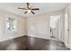 Bedroom with hardwood floors, window, and laundry access at 323 20Th St, Kannapolis, NC 28083