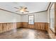 Simple bedroom with wood floors, ceiling fan, and window at 323 20Th St, Kannapolis, NC 28083
