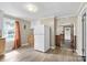 Small kitchen with white cabinets, wood countertops, and vinyl flooring at 323 20Th St, Kannapolis, NC 28083
