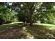 Large backyard with mature trees and a storage shed at 359 Pinnacle Rd, Kings Mountain, NC 28086