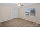 Well-lit bedroom featuring hardwood floors and a double-door closet at 2090 Cardinal Hill Dr, Rock Hill, SC 29732