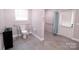 Accessible bathroom with roll-in shower and grab bars at 416 Witten Ln, Gastonia, NC 28052