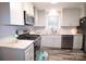 Modern kitchen featuring granite countertops and stainless steel appliances at 416 Witten Ln, Gastonia, NC 28052