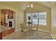 Breakfast nook with glass table and wrought iron chairs at 7300 Wahoo Ct, Gastonia, NC 28056