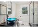 Bathroom with a blue glass sink, marble tile, and a large shower at 4165 Laurelwood Ct, Concord, NC 28025