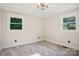 Bright bedroom with new carpet, fresh paint, and two windows at 4165 Laurelwood Ct, Concord, NC 28025