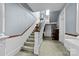 Elegant staircase with detailed woodwork in the entryway at 101 E Main St, Cleveland, NC 27013