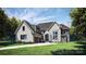 Modern two story home with large windows and attached two car garage at 11031 Harrisons Crossing Ave, Charlotte, NC 28277
