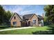 Modern home with brick facade and a two car garage at 11031 Harrisons Crossing Ave, Charlotte, NC 28277