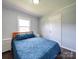 Spacious bedroom with a queen bed and ample natural light at 142 Eller Rd, Gastonia, NC 28056